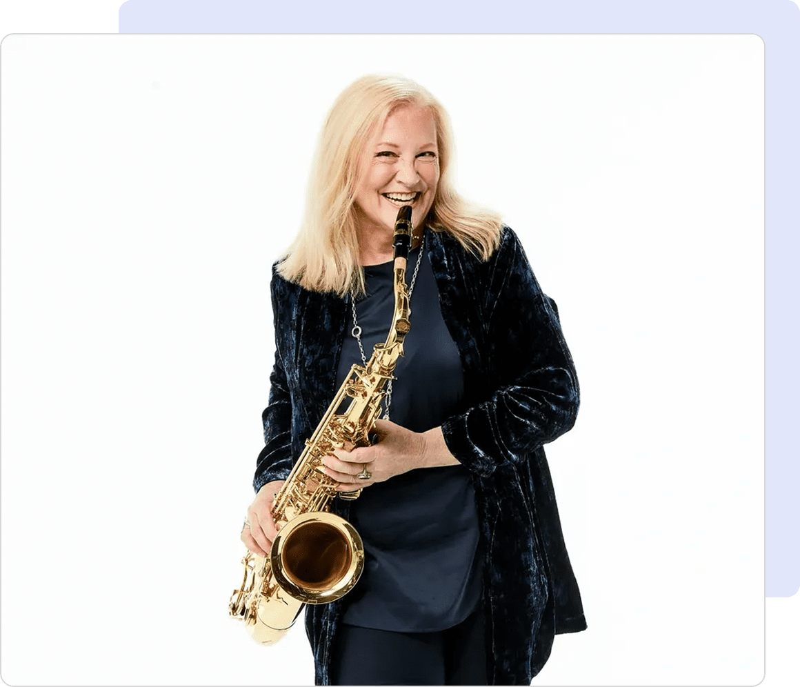 Woman smiling with a saxophone